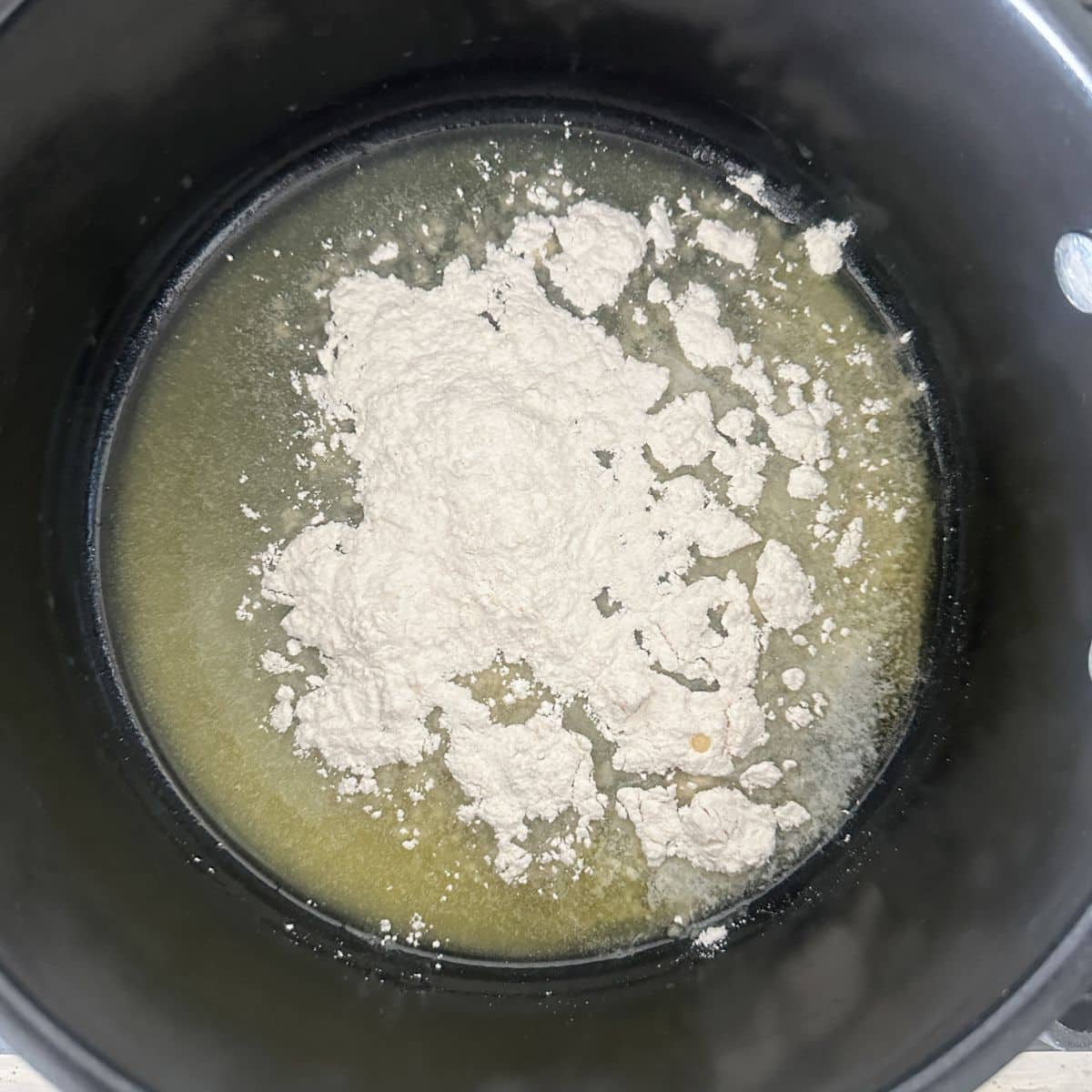 Saucepan with melted butter and flour.