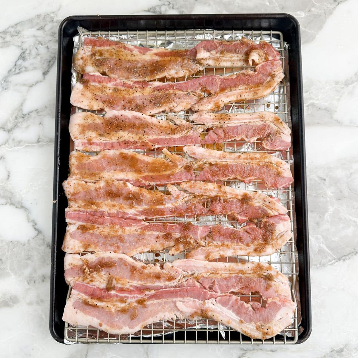 Baking pan with foil and bacon.