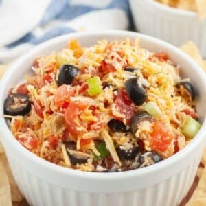 Bowl filled with poolside dip and tortilla chips.