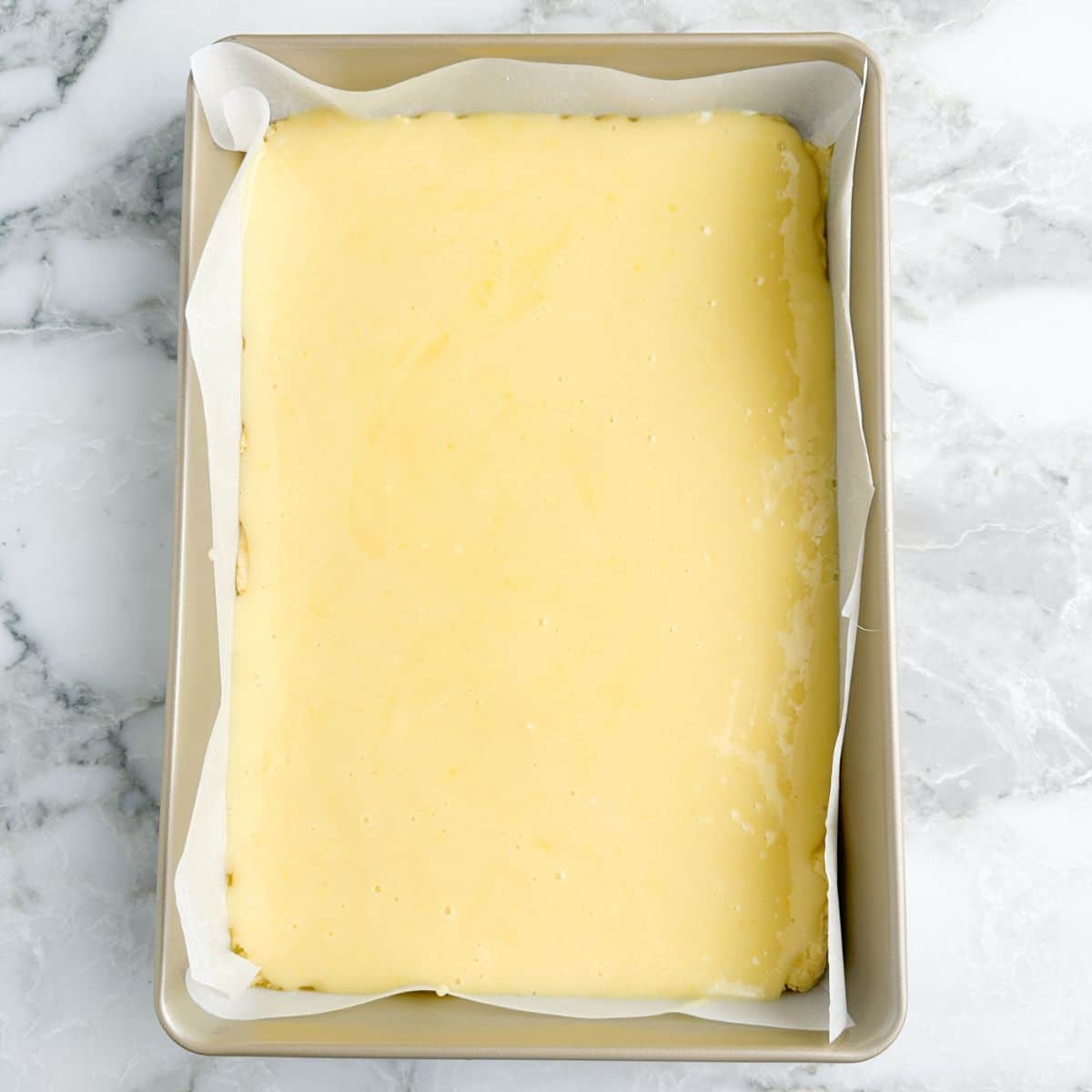 Baking dish with unbaked chess squares.