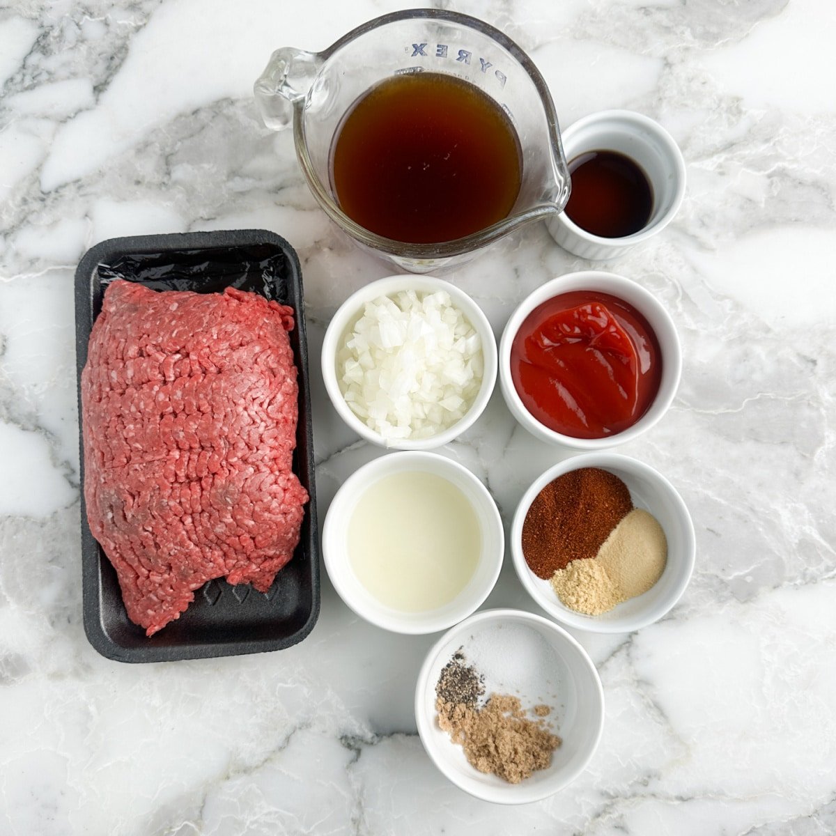 Ground beef, beef broth, seasonings, diced onion, ketchup, and Worcestershire sauce.