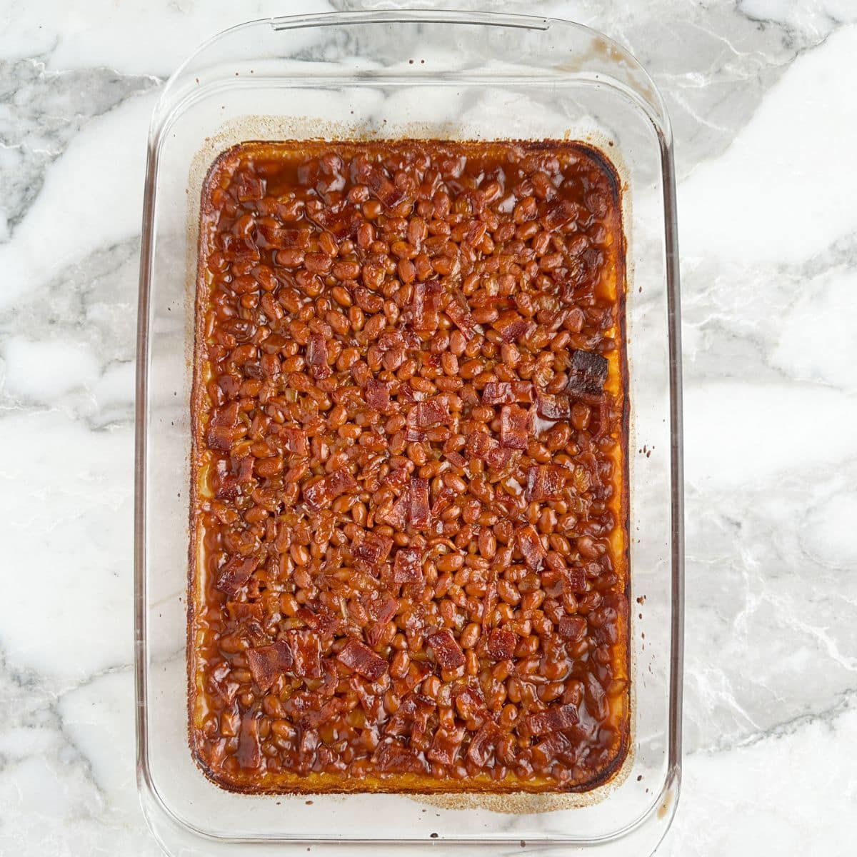 Baked beans in a casserole dish.