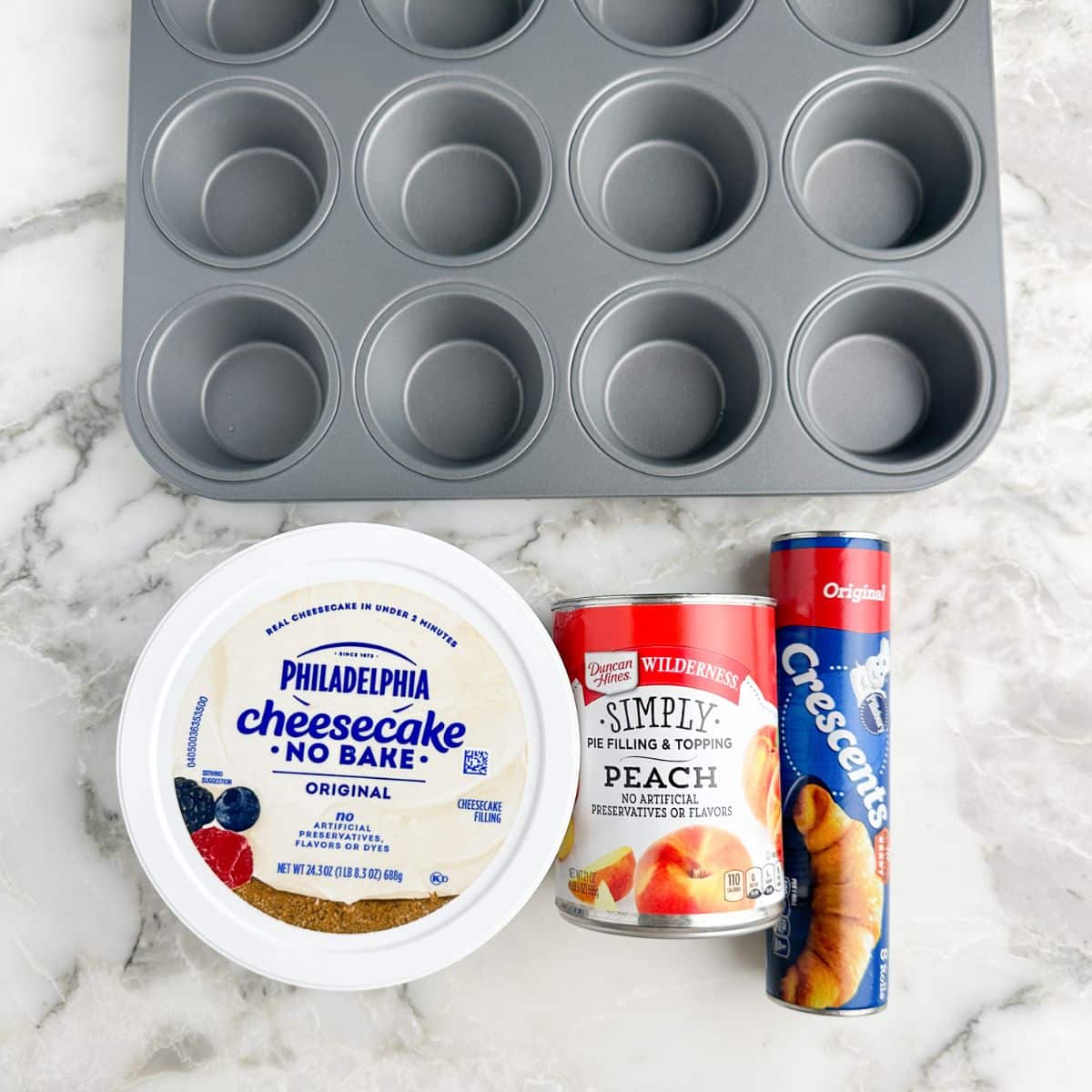 Tub of Philadelphia cheesecake mixture, can of peach pie filling, can of crescent rolls.