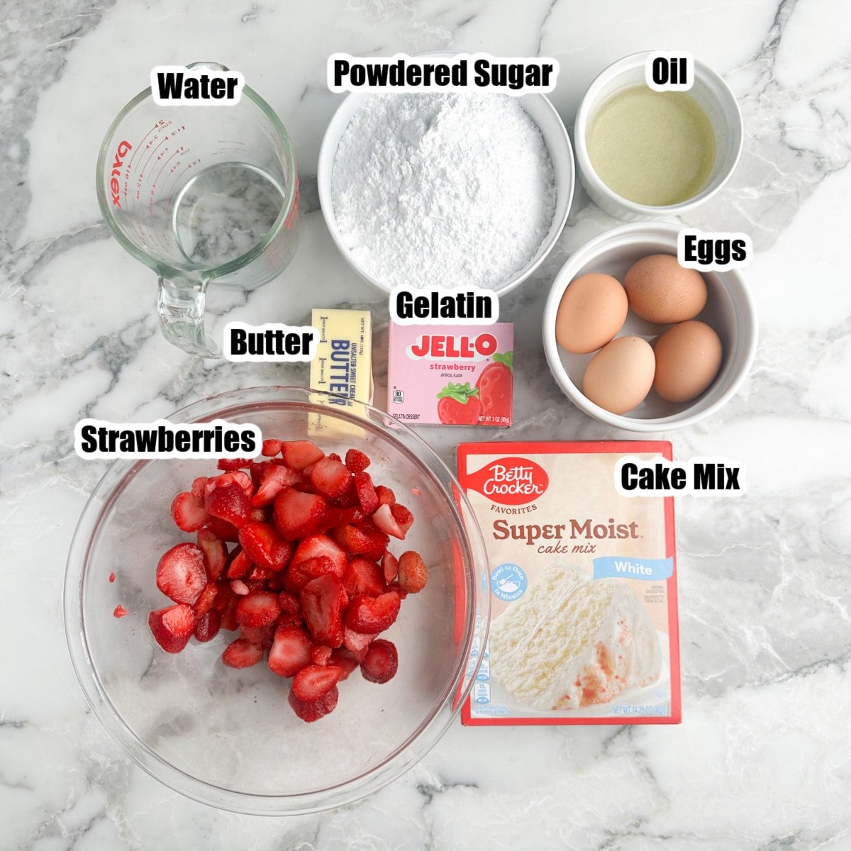 Boxed cake mix, bowl of strawberries, eggs, butter, powdered sugar, oil, gelatin, and water.
