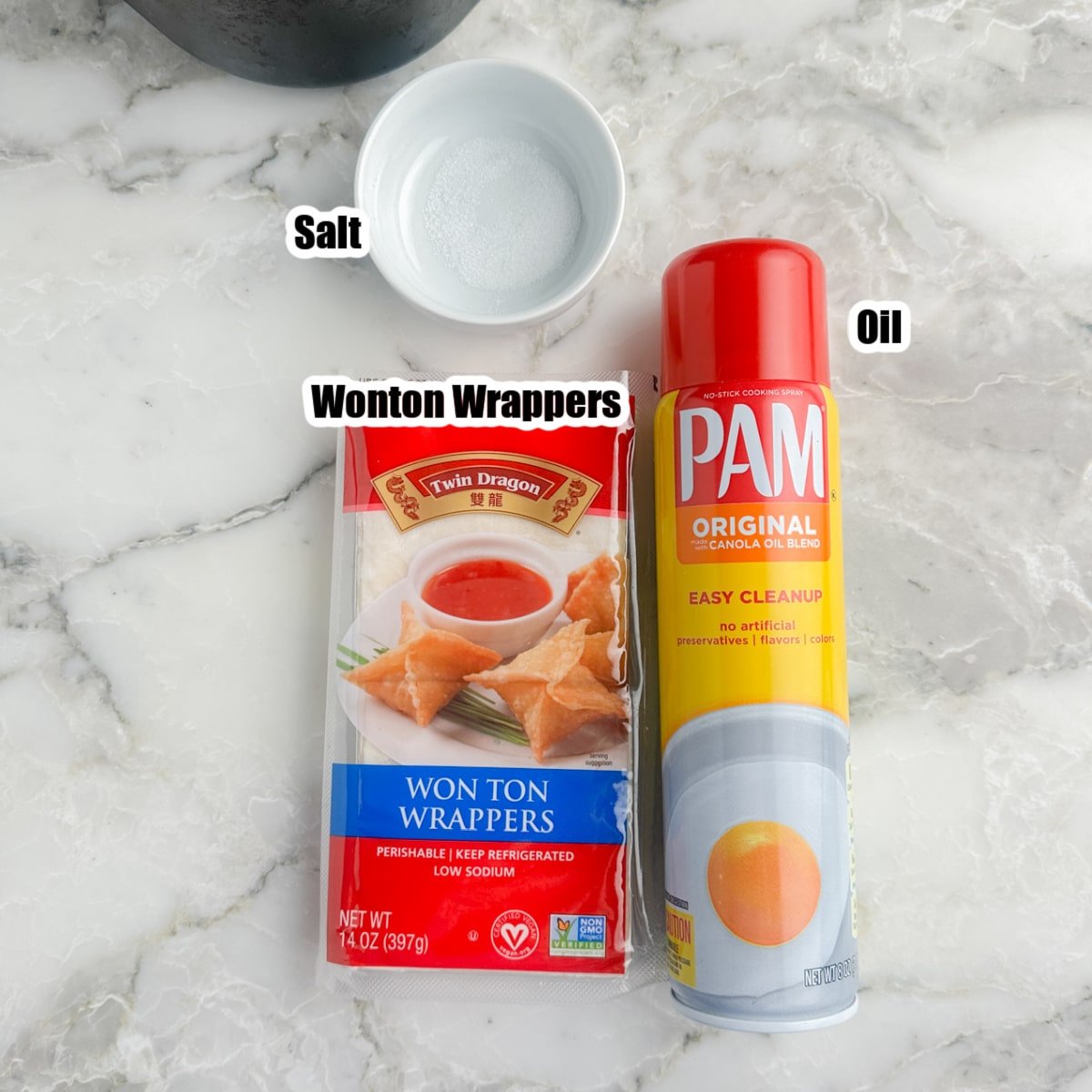 Package of wonton wrappers, bowl of salt, and Pam cooking spray.