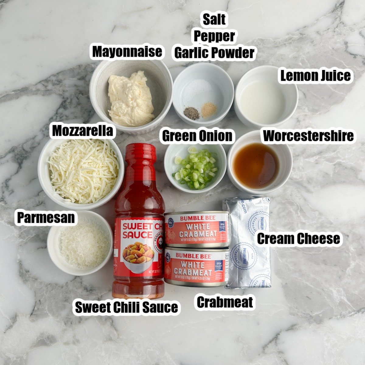 Crab meat, cheese, sweet chili sauce, mayonnaise, cream cheese, seasonings, worcestershire sauce, green onions.
