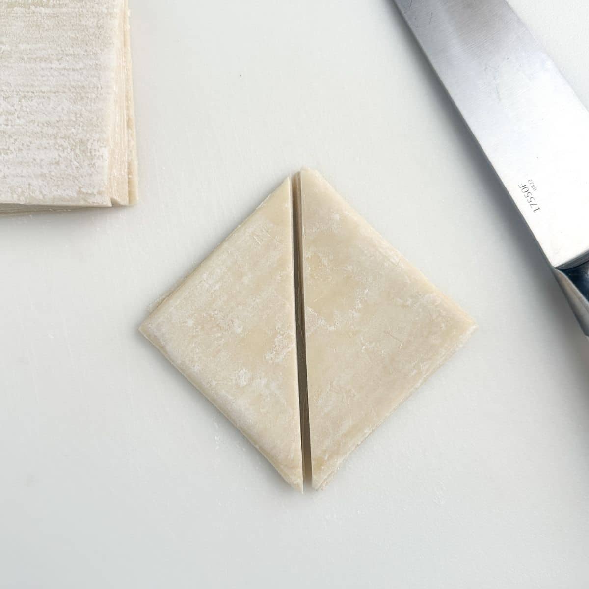 Wonton wrappers cut in half.