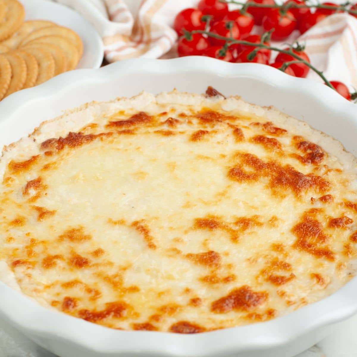 Baking dish with cooked chicken alfredo dip. 