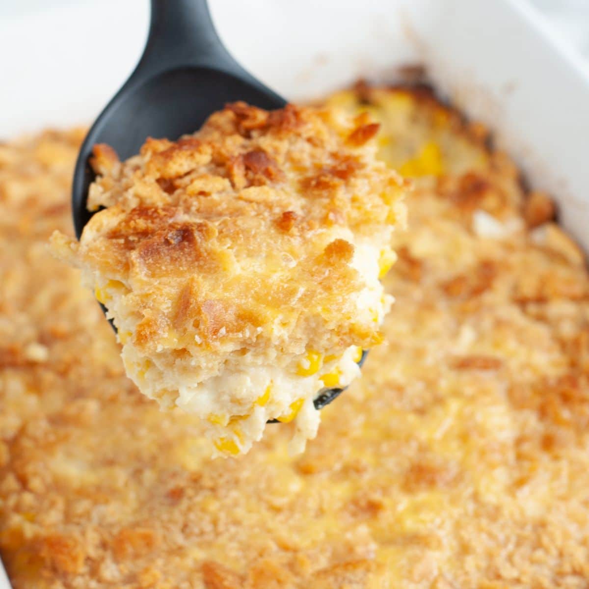 Spoon with Swiss corn bake. 