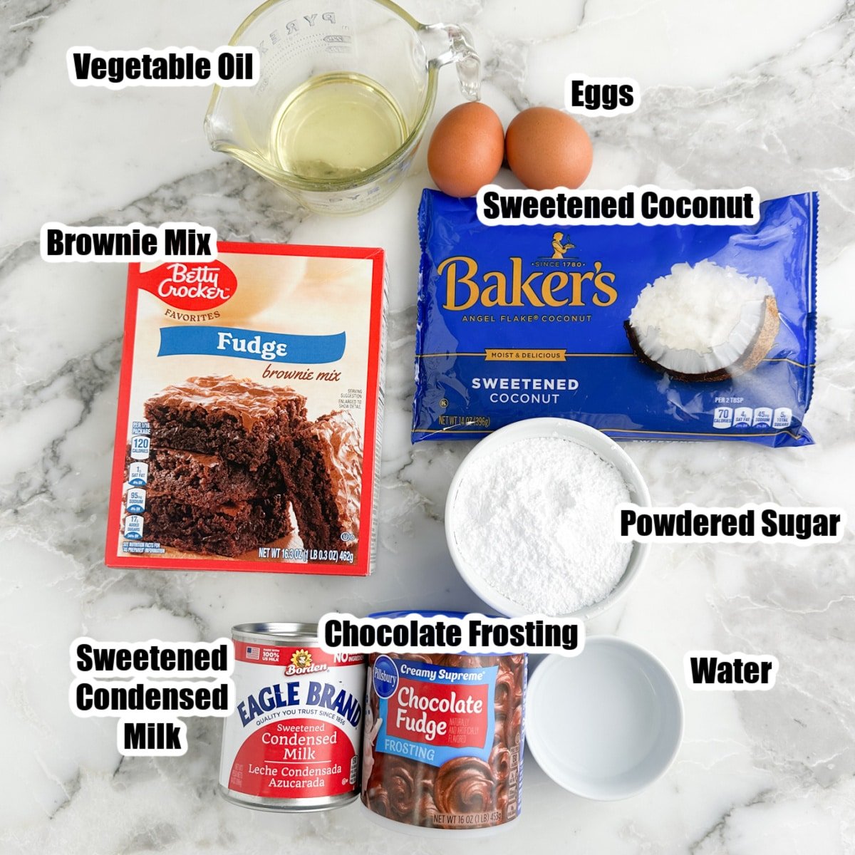 Box of brownie mix, sweetened coconut, frosting, eggs, oil, powdered sugar, and sweetened condensed milk. 