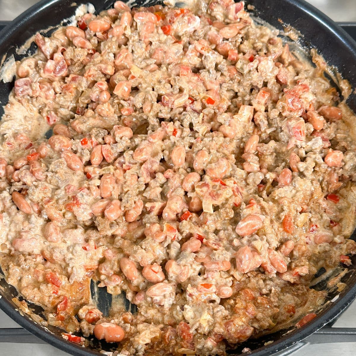 Skillet with ground beef mixture.