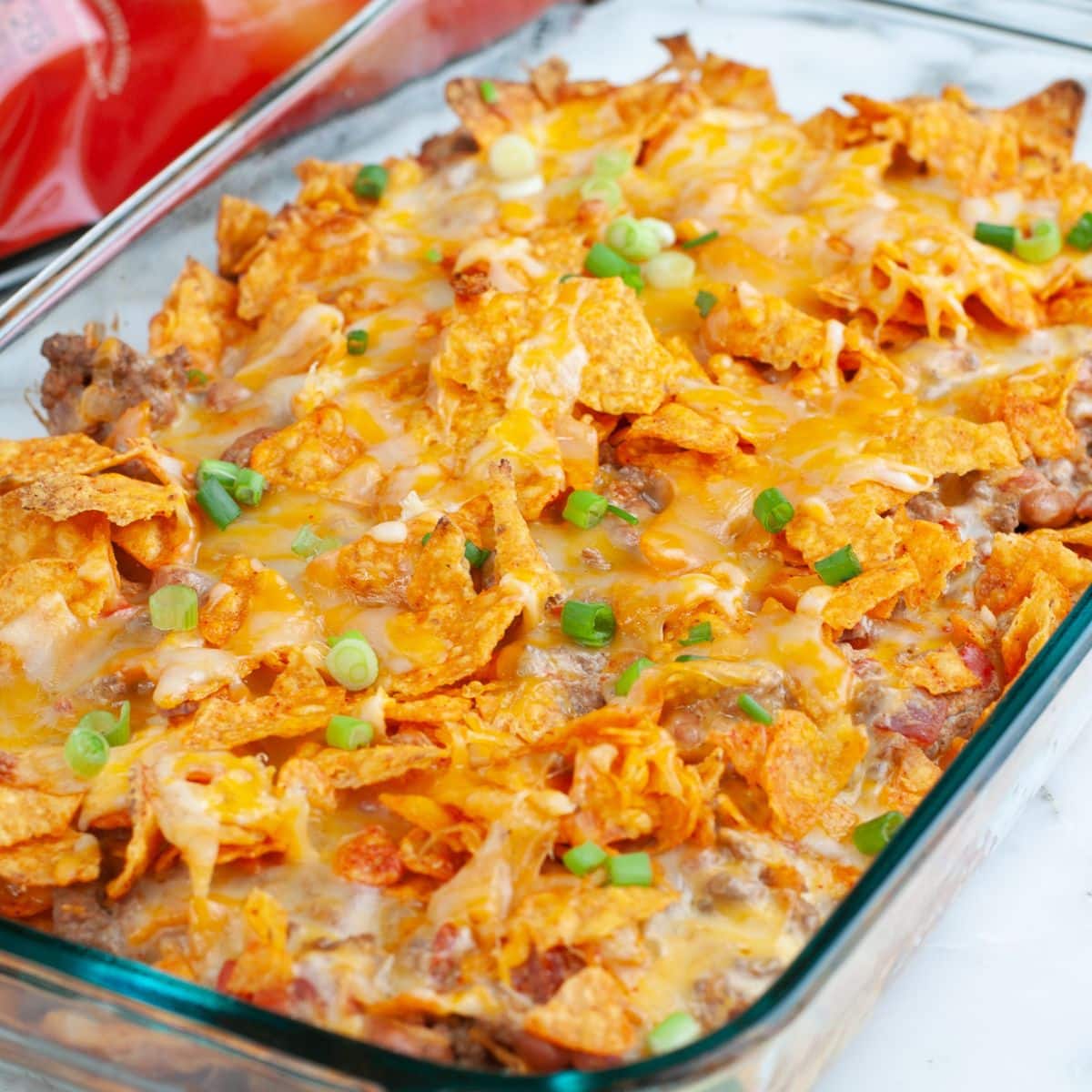 Casserole dish with Doritos casserole.