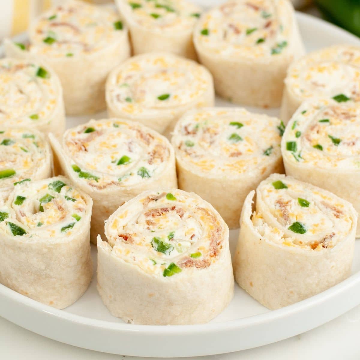 Plate of jalapeno popper pinwheels.