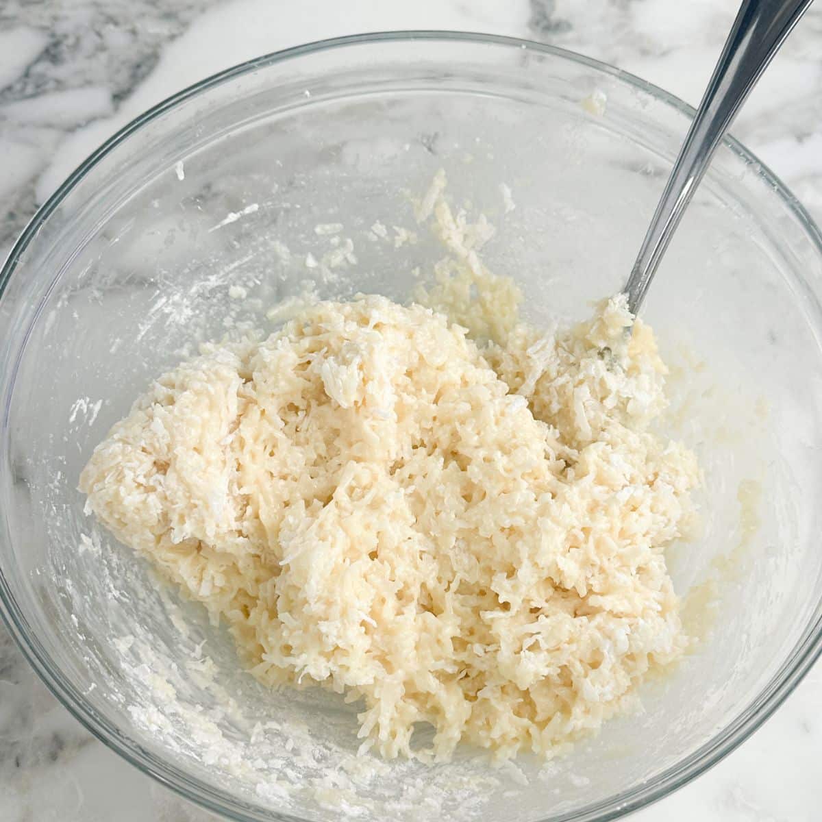 Bowl with filling for coconut balls.