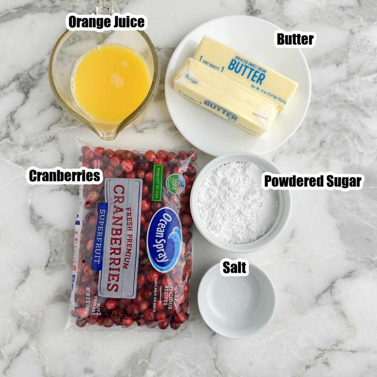 Bag of cranberries, orange juice, butter, powdered sugar, and salt.