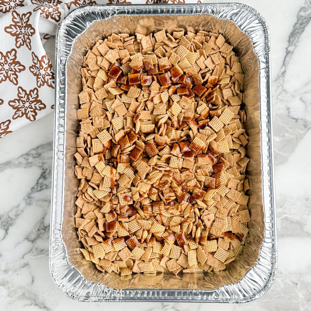 Roasting pan filled with cereal.