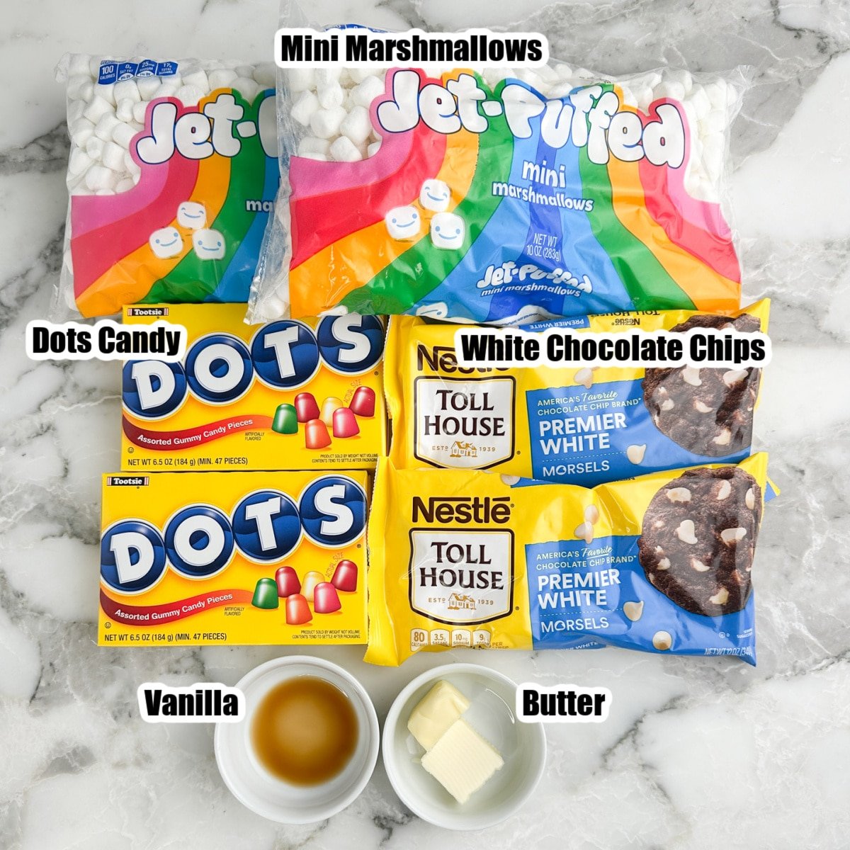 Bags of mini marshmallows, white chocolate chips, Dots, vanilla, and butter.