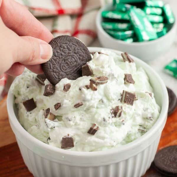 Bowl with Oreo cookie dipping into mint chocolate chip dip.
