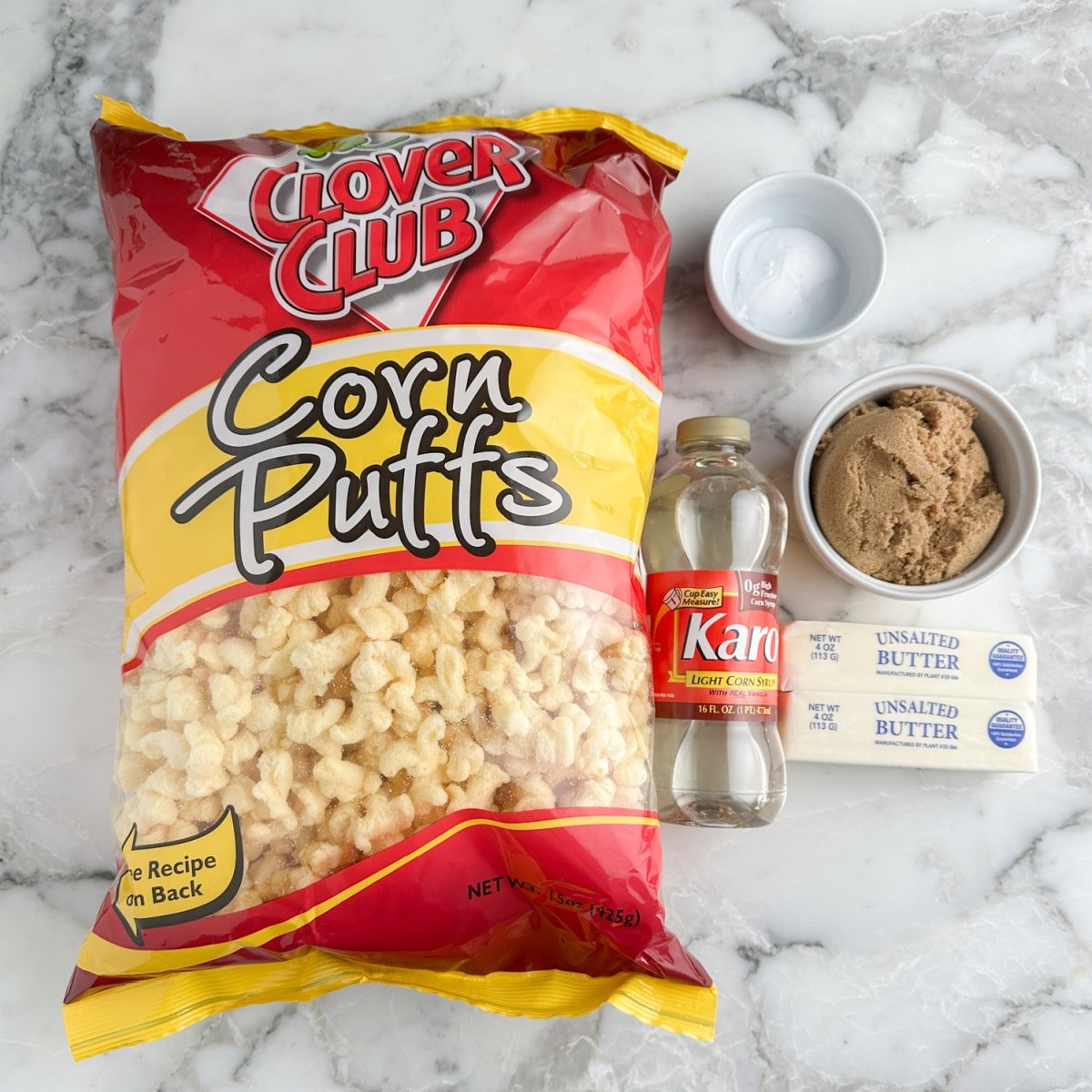 Bag of puffcorn, corn syrup, brown sugar, butter, and baking soda.