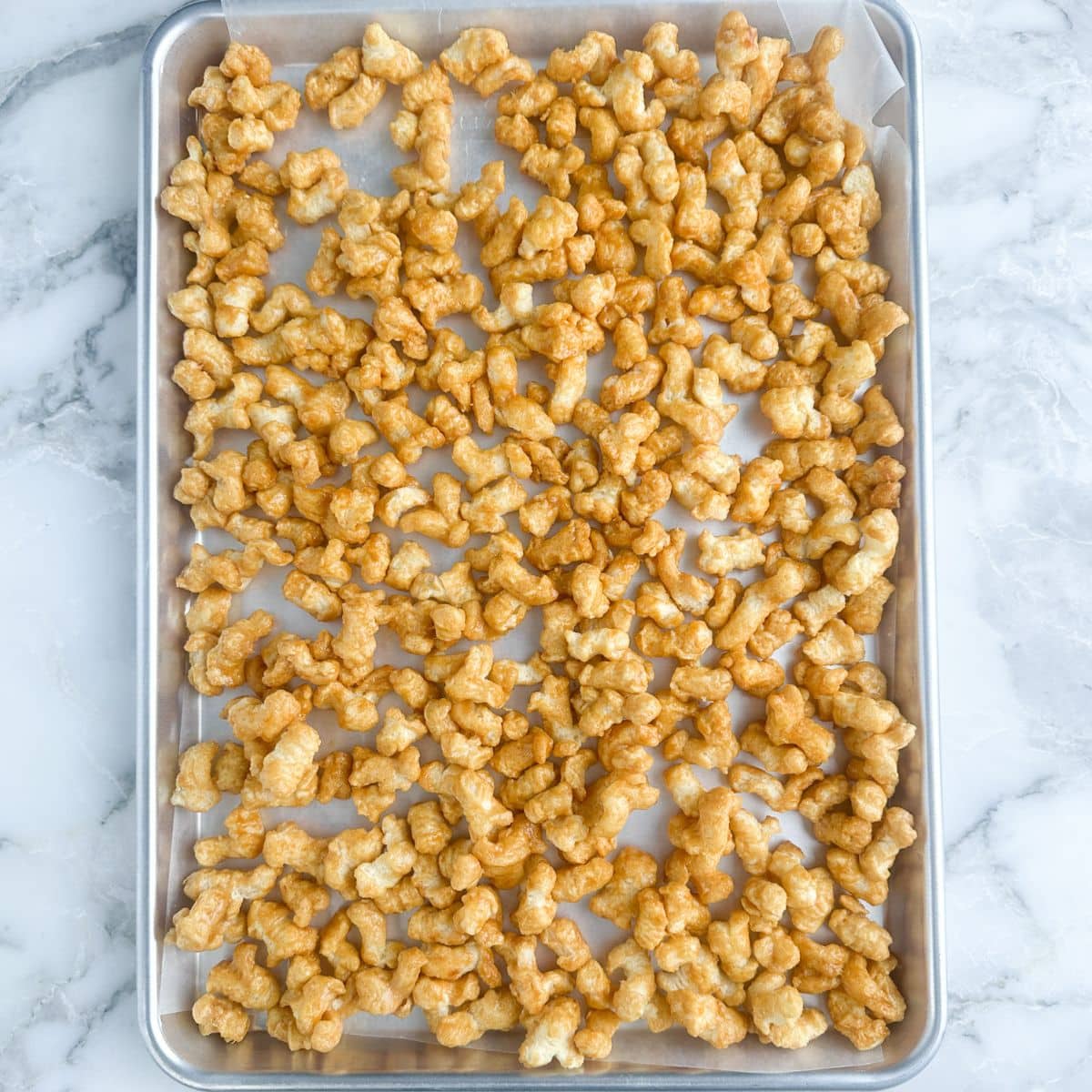 Baking pan with caramel puffcorn. 