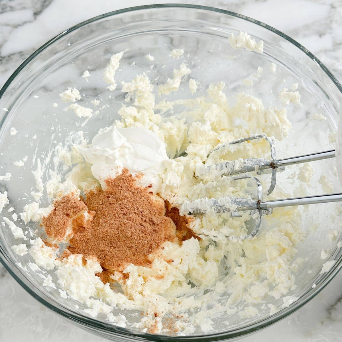 Bowl of mixed cream cheese, sour cream, mayonnaise, and seasonings. 
