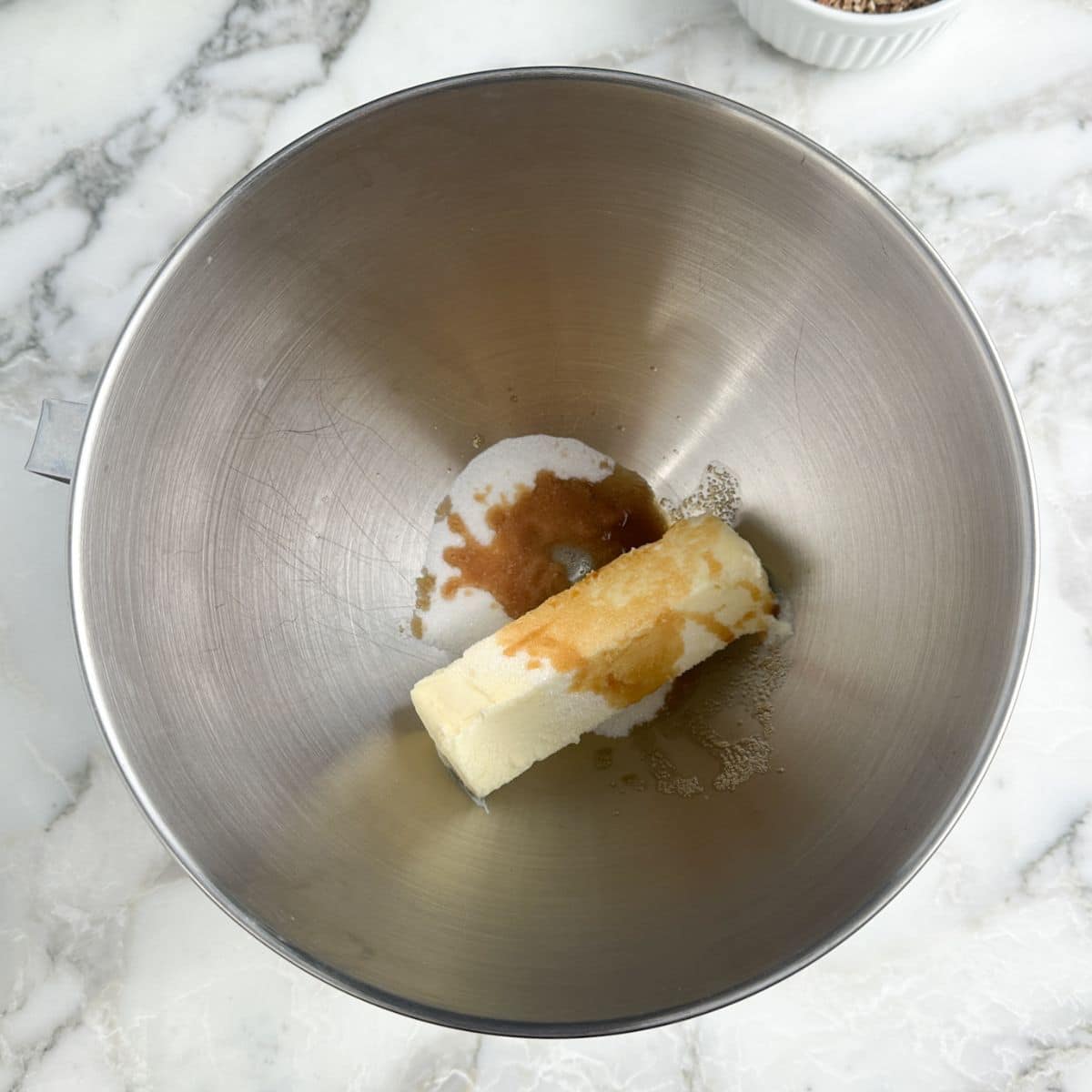 Mixing bowl with butter, sugar, and vanilla. 