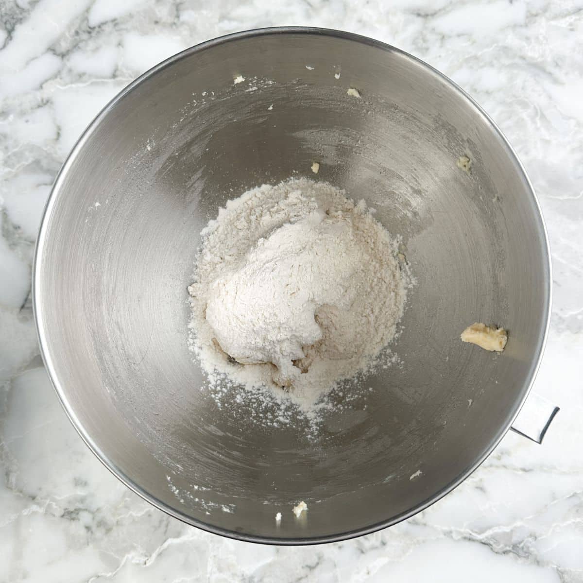 Mixing bowl with butter, and flour. 
