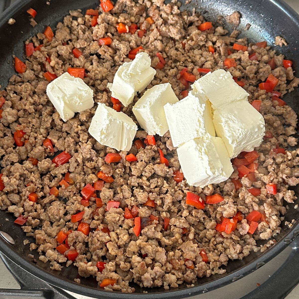 Ground sausage, red bell pepper, and cream cheese.
