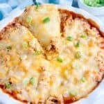 Chicken tamale pie and a piece on a serving spoon.