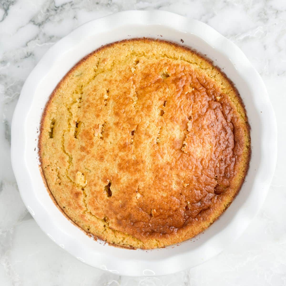 Pie dish with baked cornbread.
