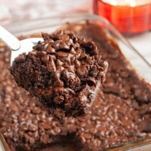 Piece of chocolate dump cake on a spatula.