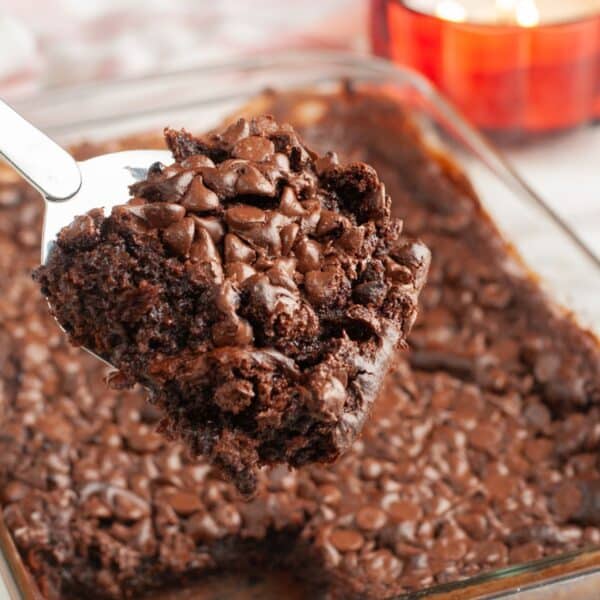 Piece of chocolate dump cake on a spatula.