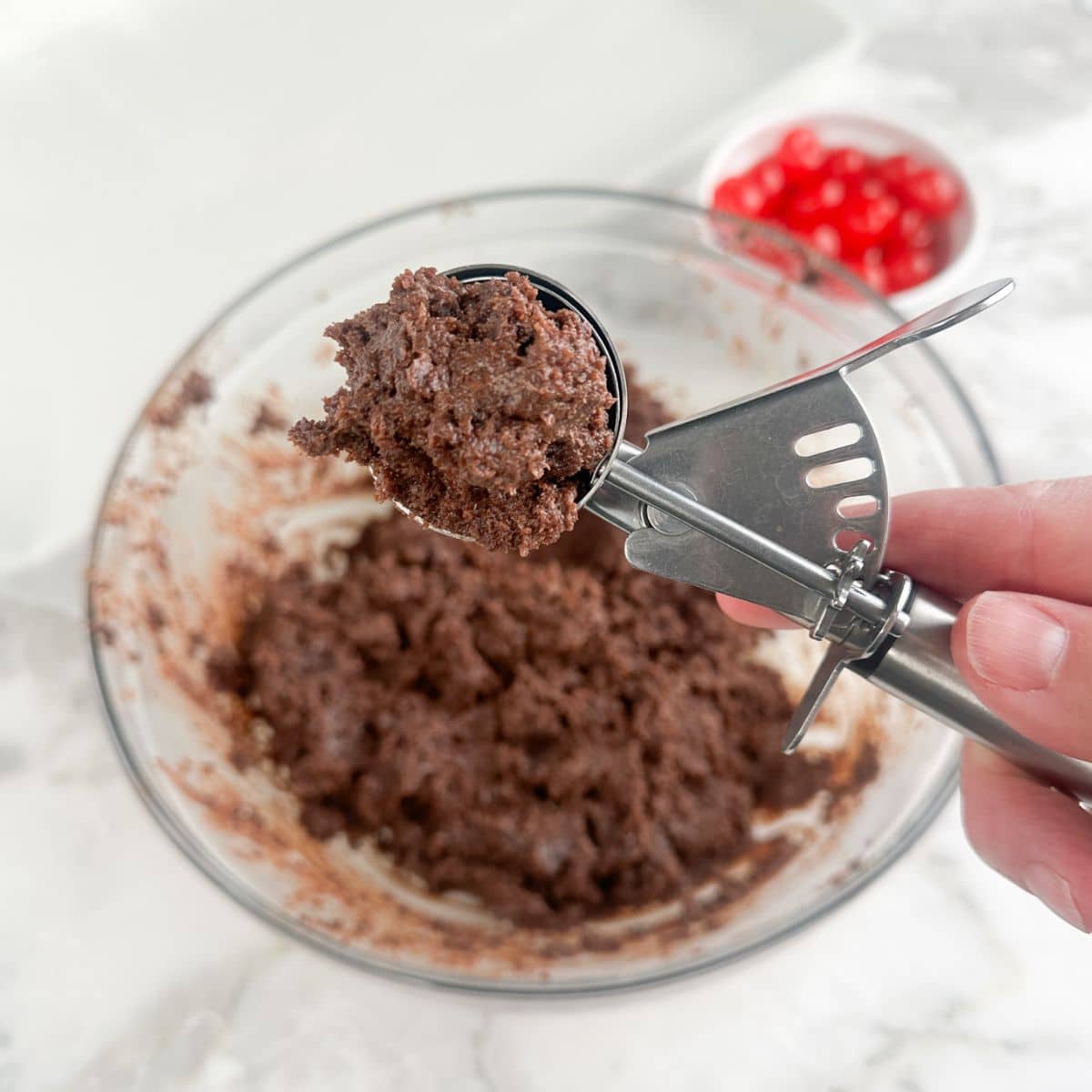 Cookie dough scoop with brownie bite batter. 