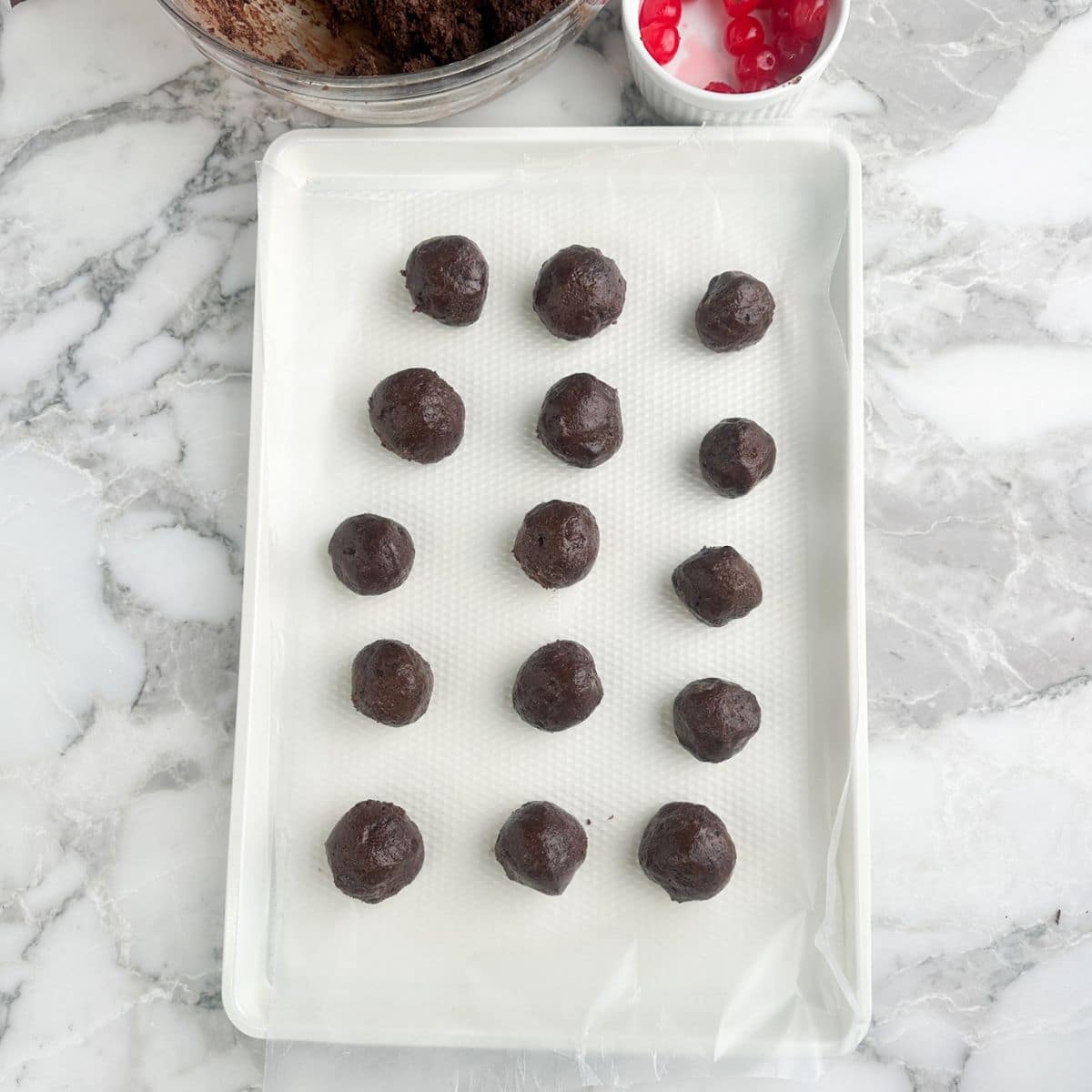 Baking pan with brownie bomb bites. 