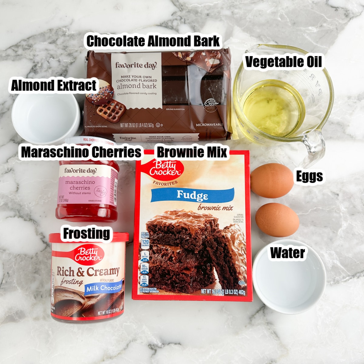 Box of brownie mix, almond bark, vegetable oil, eggs, maraschino cherries, and tub of frosting. 