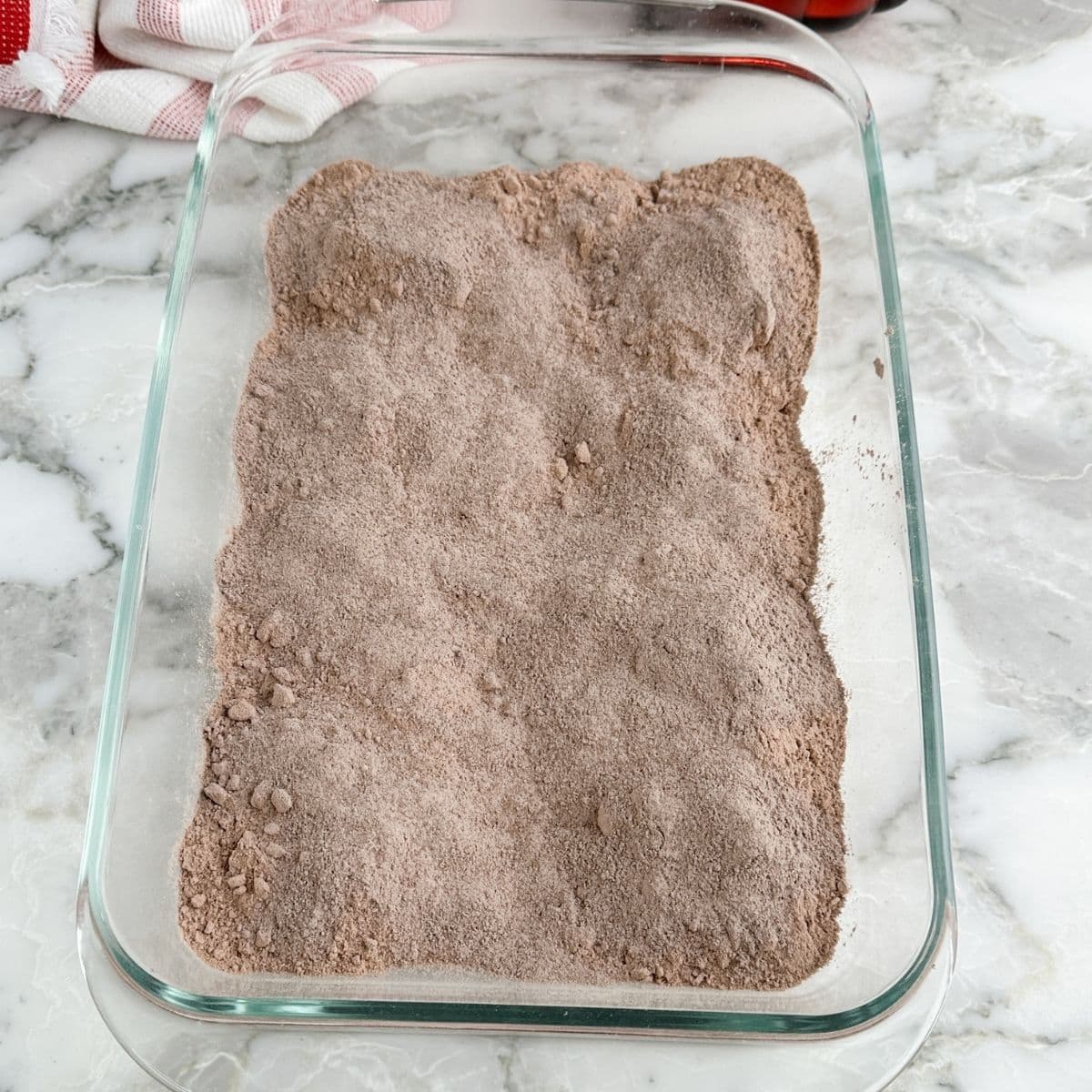 Baking dish with chocolate cake mix and pudding mix. 