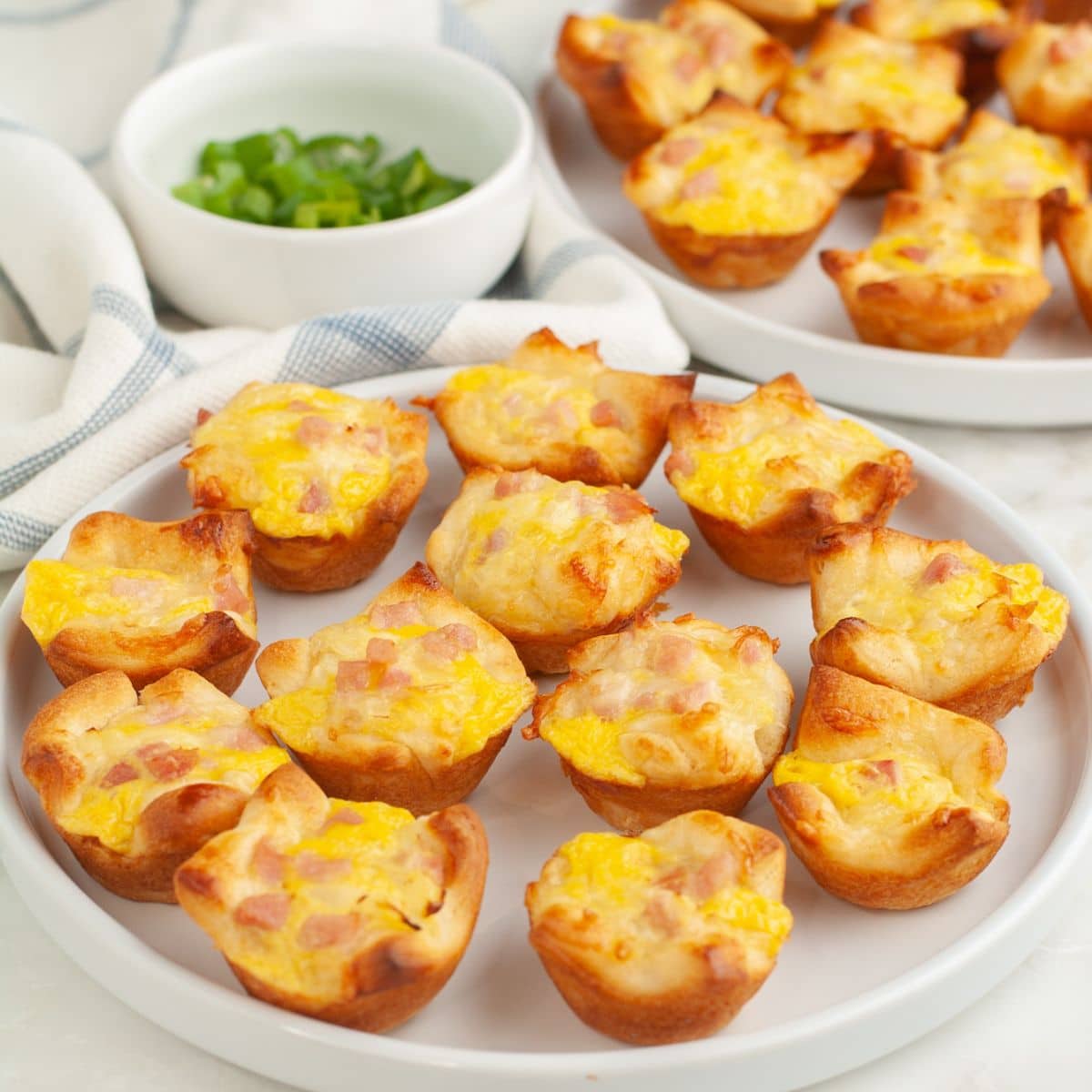 Plate of ham and cheese puffs. 