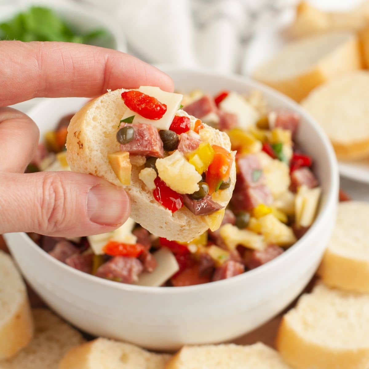Piece of bread with muffuletta dip.