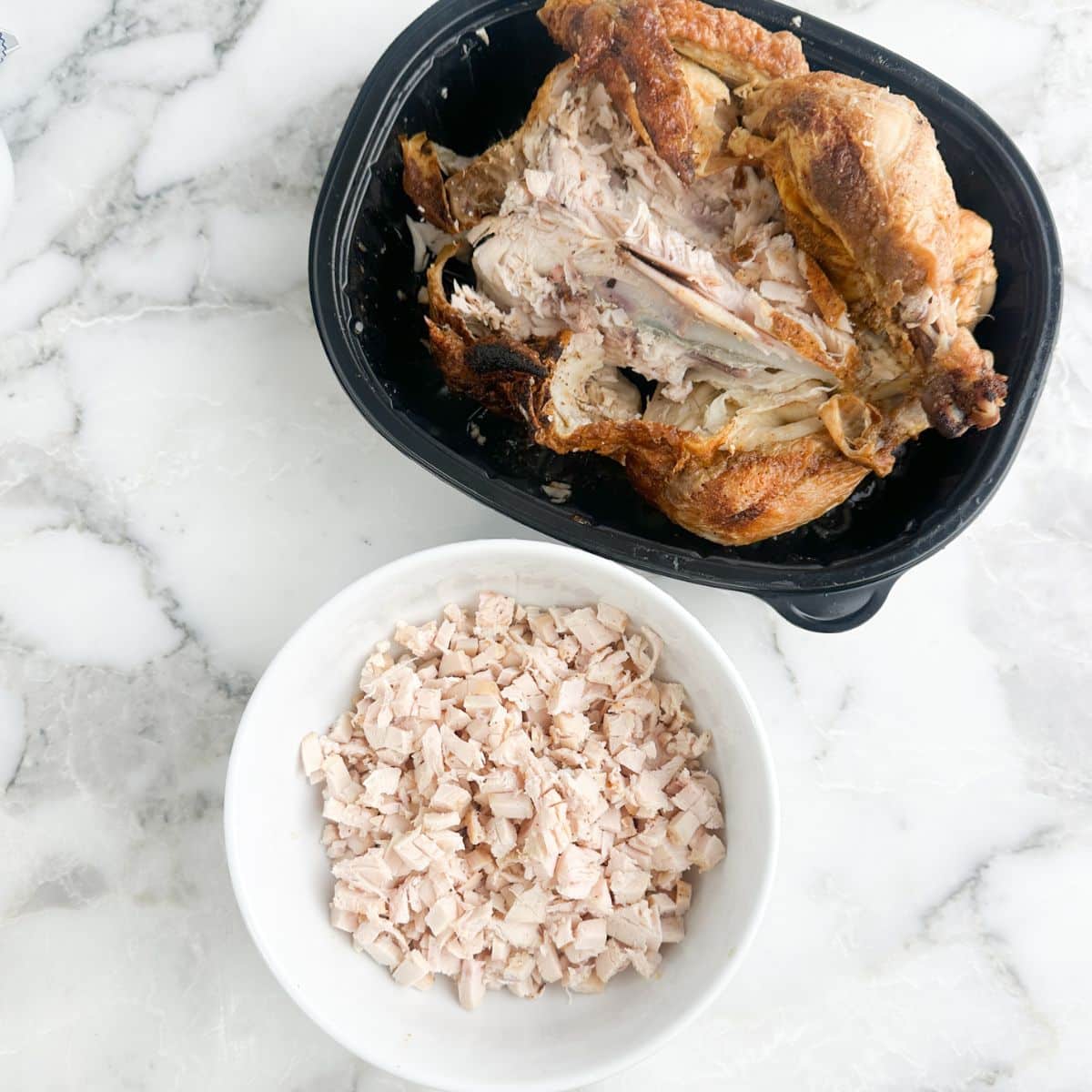 Shredded rotisserie chicken in a bowl.