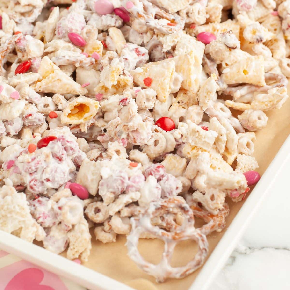 Baking pan with Valentines cupid snack mix.