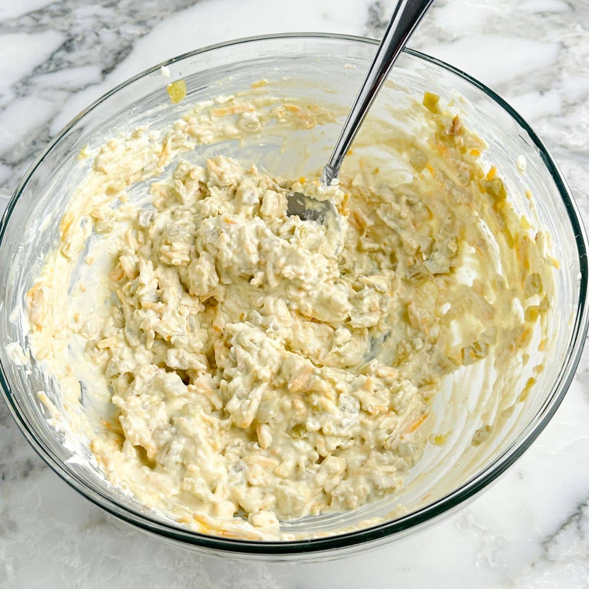 Bowl of creamy cream cheese with green chiles.