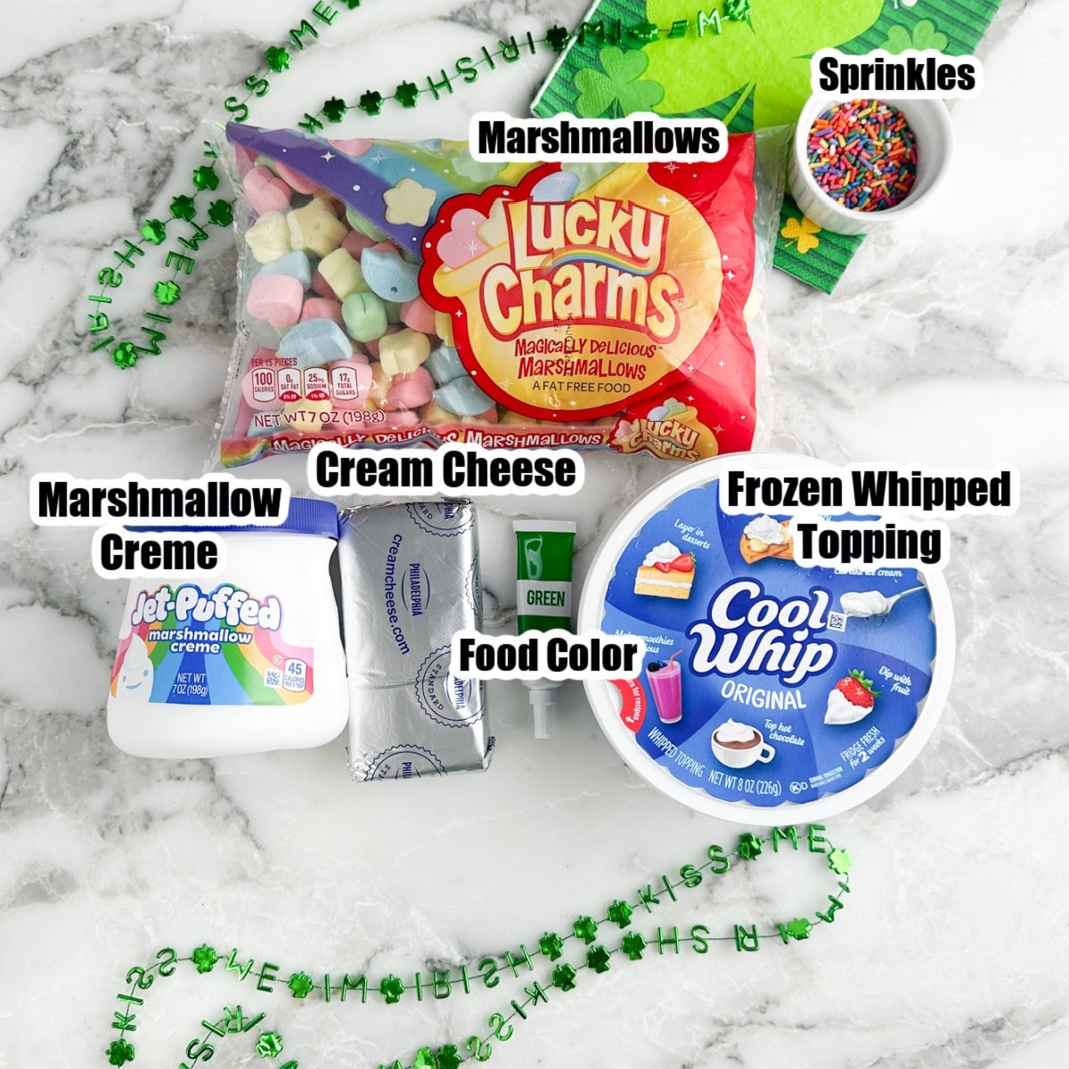 Bag of colorful marshmallows, jar of marshmallow creme, cream cheese, green food coloring, and Cool Whip. 