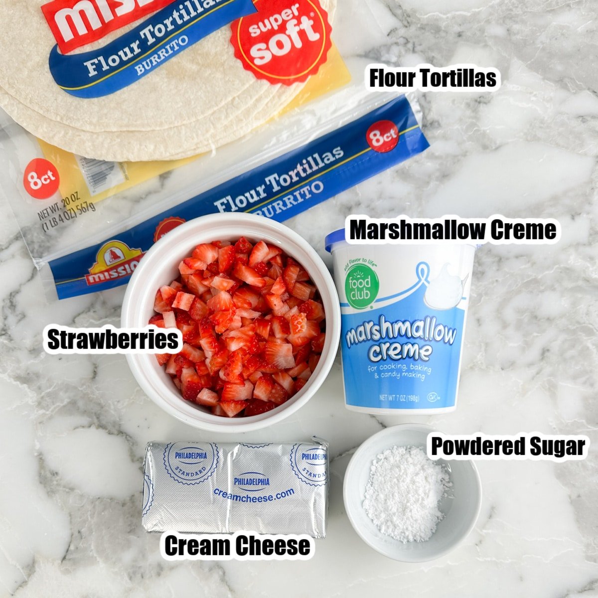 Bowl of diced strawberries, cream cheese, powdered sugar, marshmallow creme, and tortillas. 