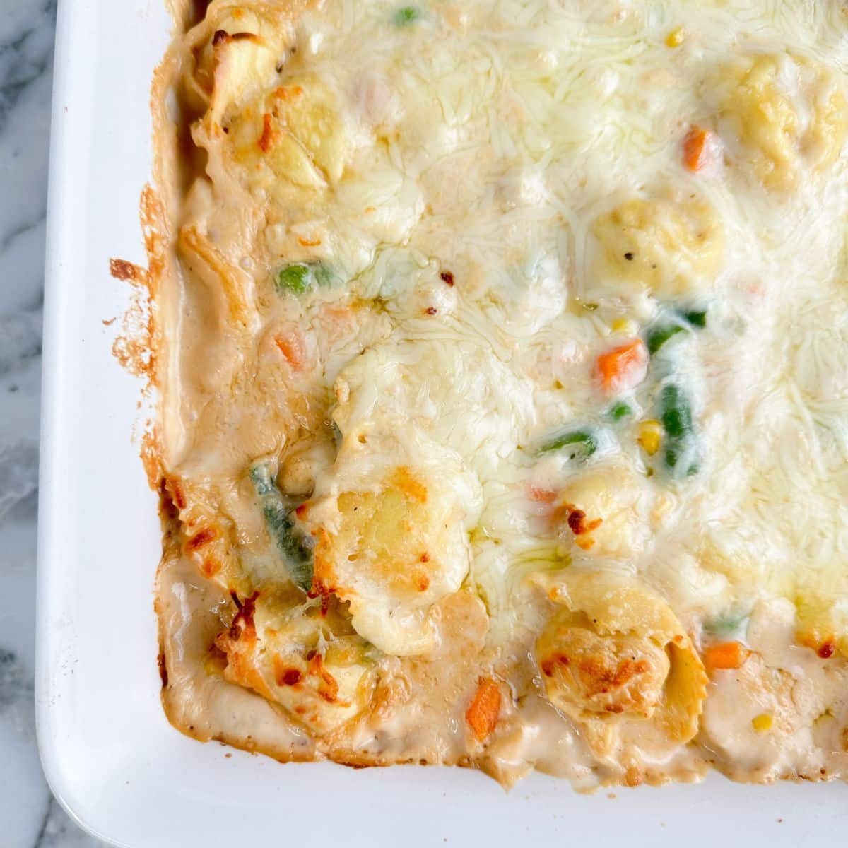 Baking dish with tortellini casserole.
