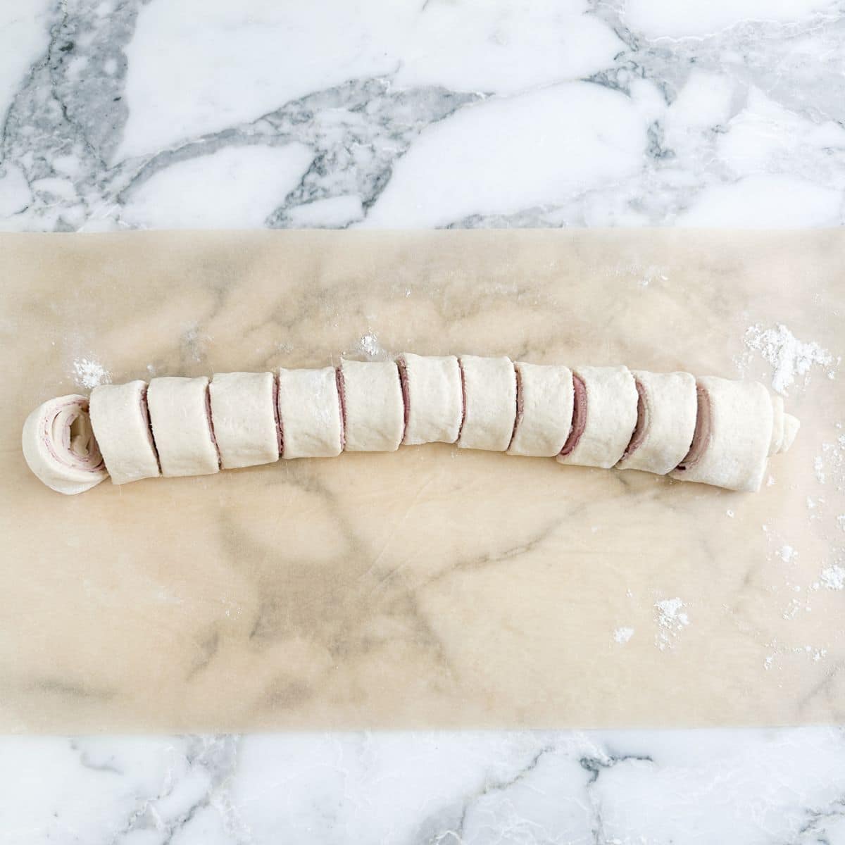 Sliced ham and cheese roll. 