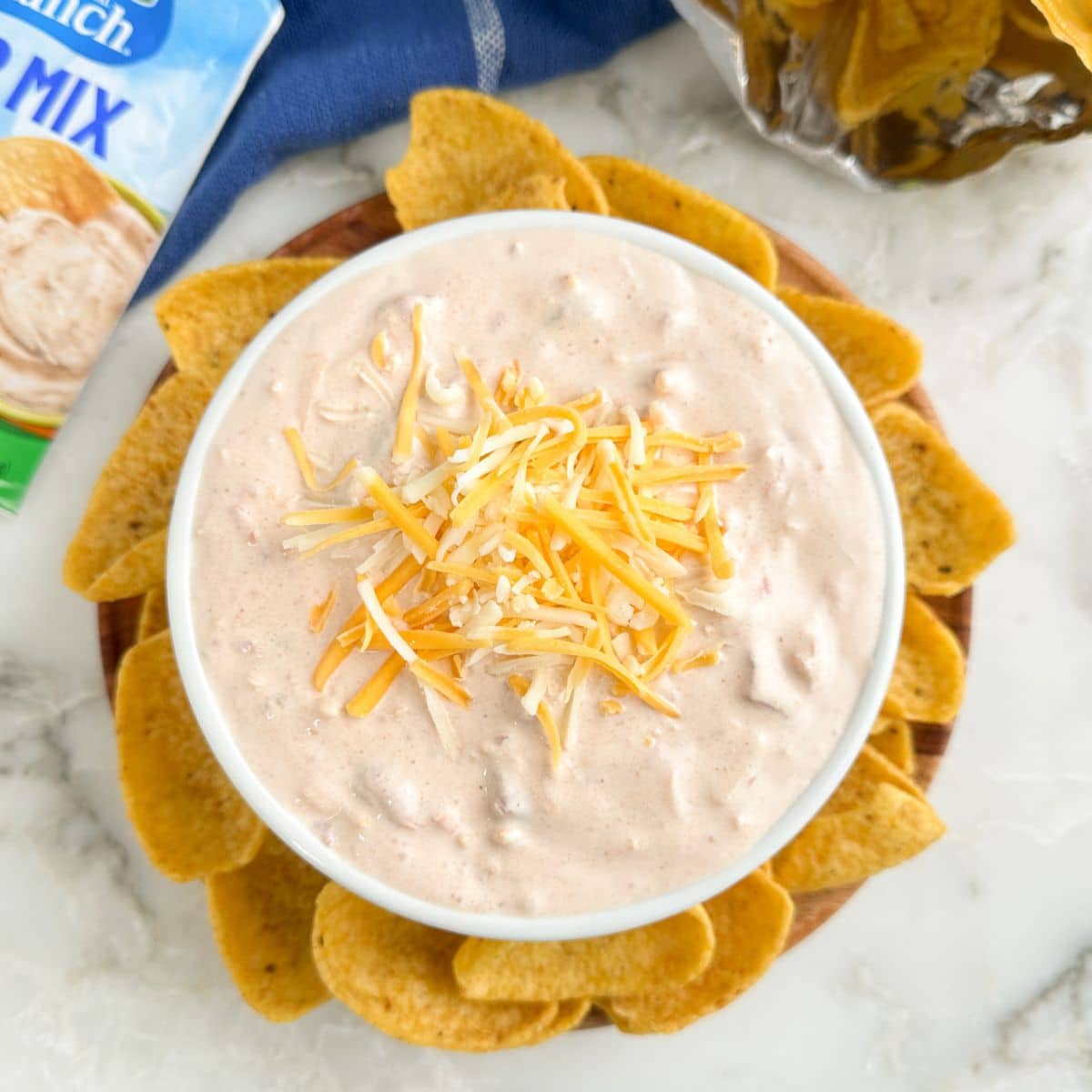 Bowl of fiesta ranch dip with corn chips.