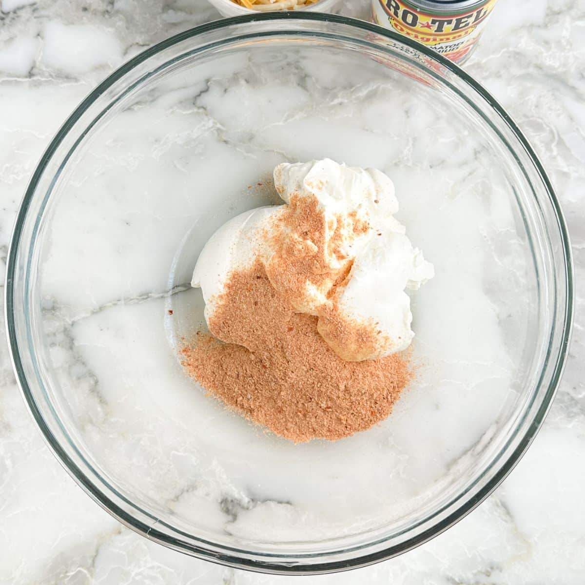Bowl of sour cream with fiesta ranch seasoning. 