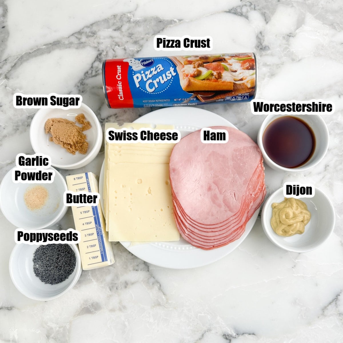 Pizza crust, ham, cheese, brown sugar, butter, garlic powder, Worcestershire, mustard, and poppyseeds. 