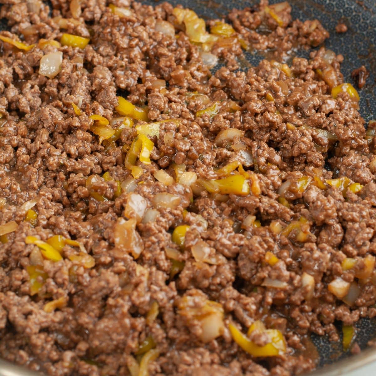 Ground beef in a skillet.