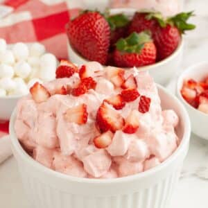 Bowl with strawberry fluff topped with diced strawberries.